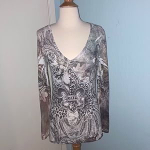 Woman’s long sleeved beaded top